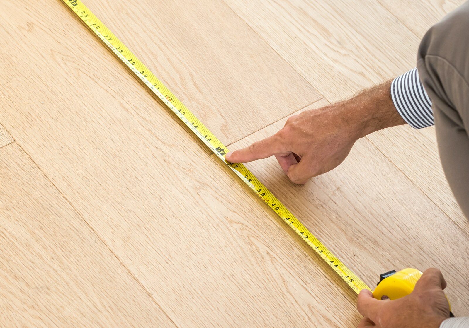 Man measure flooring | Great Floors